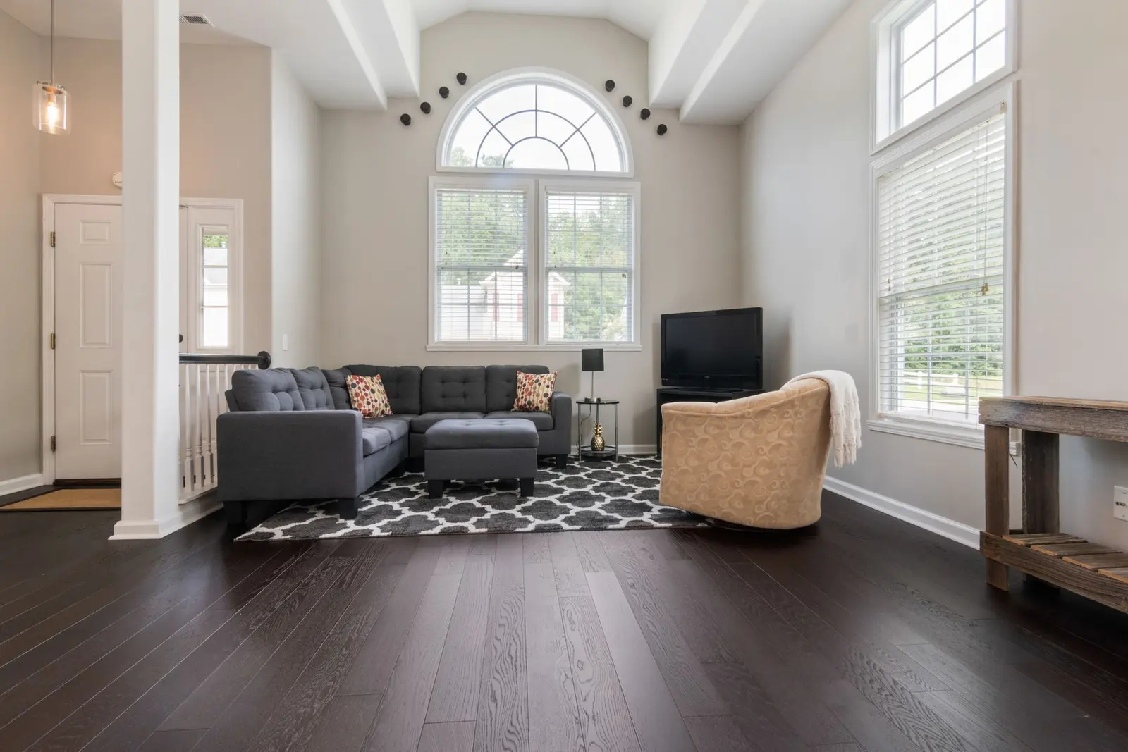 Illustrative bright living room with high ceilings
