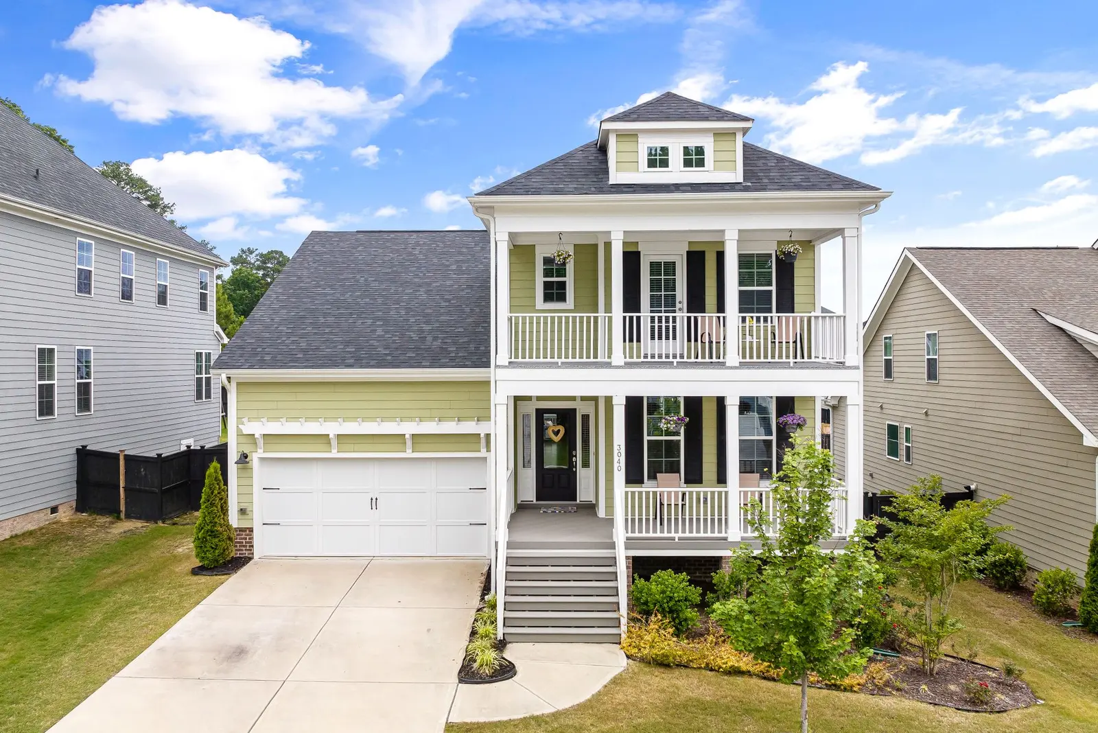 Illustrative two-story house with covered porches
